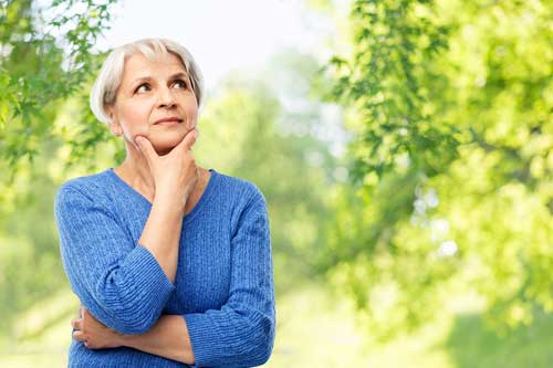 Older woman pondering health care questions