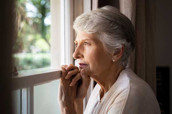 Senior woman at home pondering diagnosis
