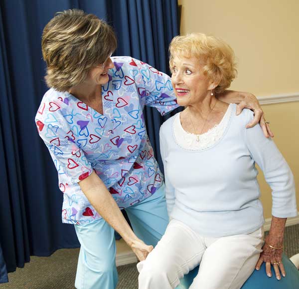 Physical therapist applying physical therapy to patient