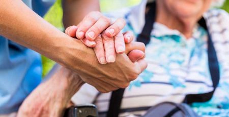 Qualities of a Caregiver - a Caregiver assisting a patient