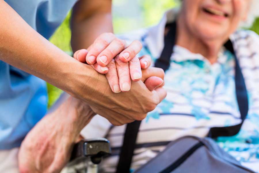 Qualities of a Caregiver - a Caregiver assisting a patient